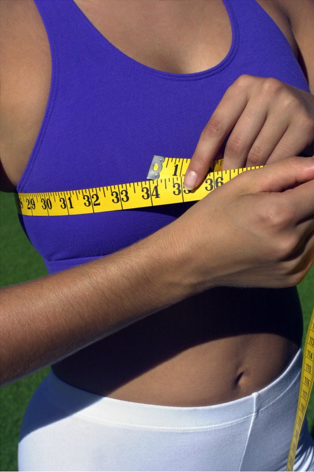 Sports Girl Measures the Chest with a Measuring Tape. Measurement