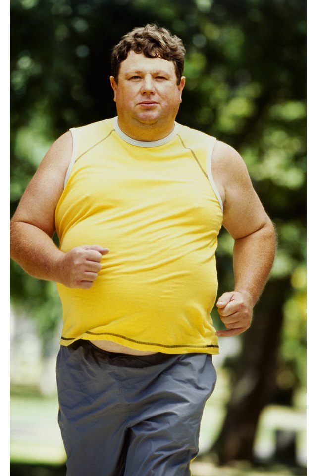 portrait of a mid adult man jogging in a park