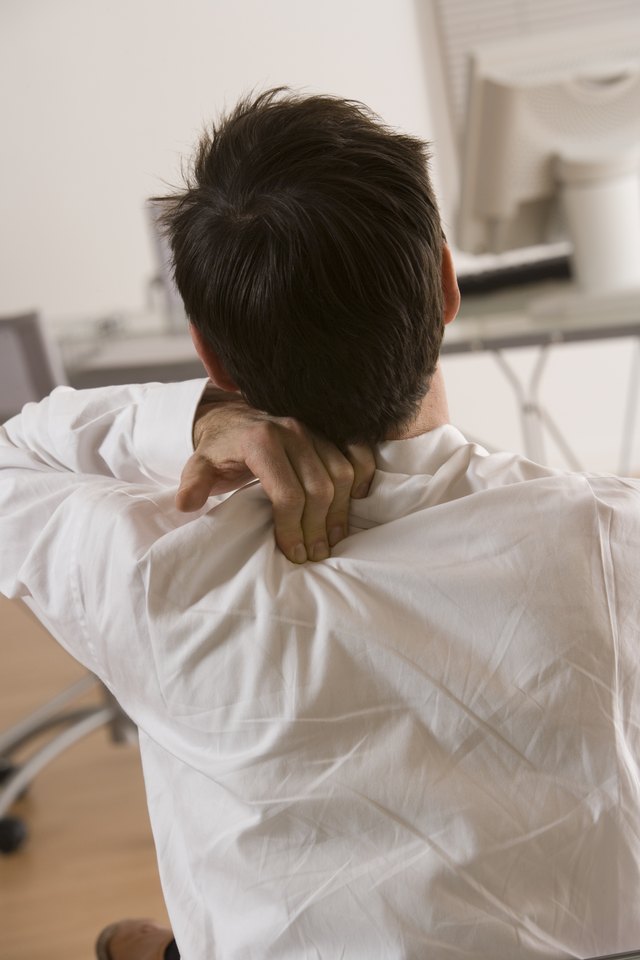 Man rubbing his shoulder