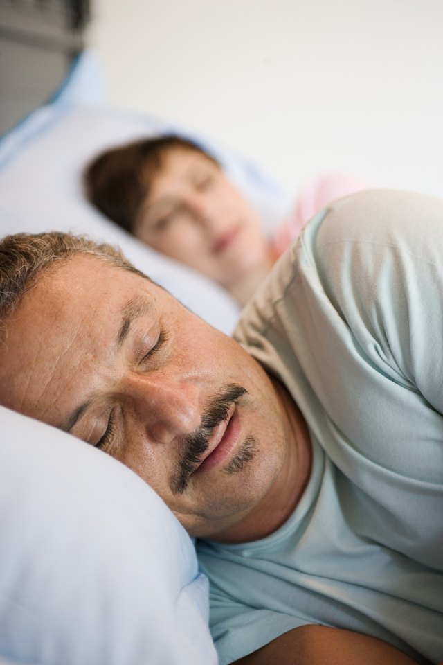 Couple sleeping in bed