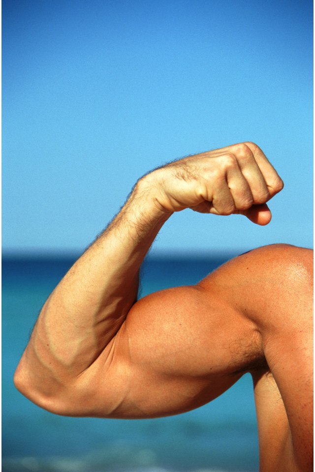 Man flexing muscles, focus on hand