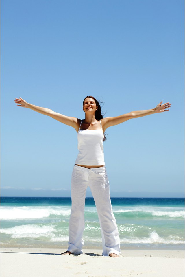 Woman stretching on beach