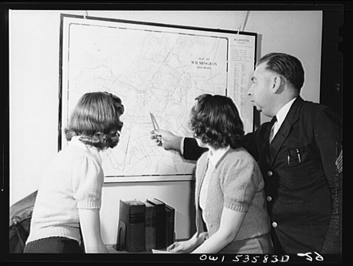 Delaware students looking at map