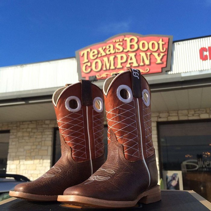 Western-style cowboy spurs on boots in Fort Worth, Texas Stock