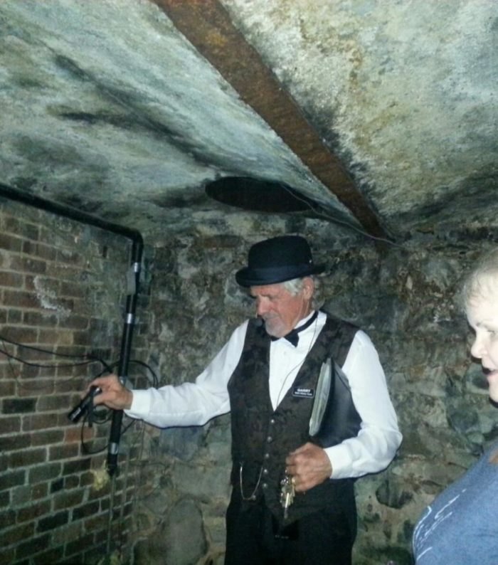 Docent leading an underground ghost tour of downtown Lewiston Idaho