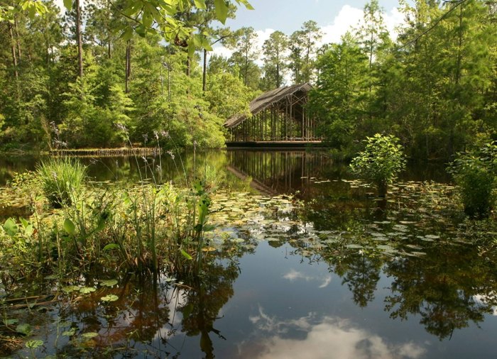 Pinecote Pavilion in Mississippi on the banks of a small pond