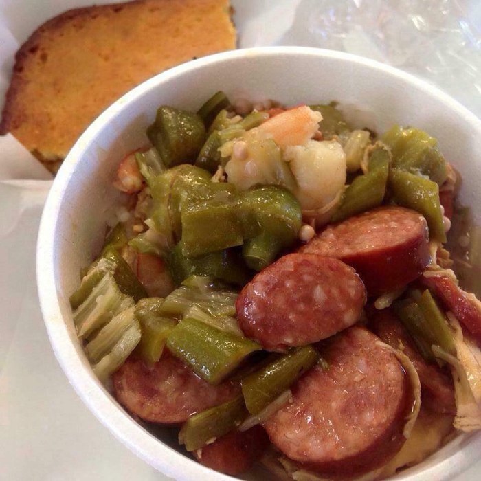 Bowl of fresh gumbo with a side of cornbread at Excellent Choice restaurant in Kansas