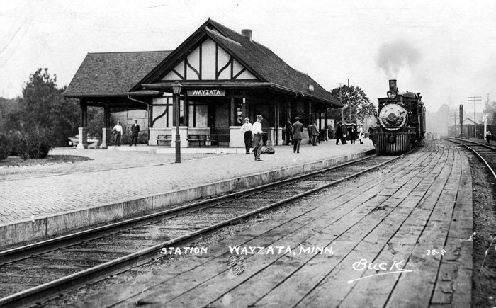 Train arriving at the Wayzata Depot. Year unknown. There is still 2 sets of RR tracks. Passenger service was discontinued in 1958 and it operated as a flag stop for the next 13 years. The depot closed as an official railroad depot in 1971 and was donated to the city of Wayzata.