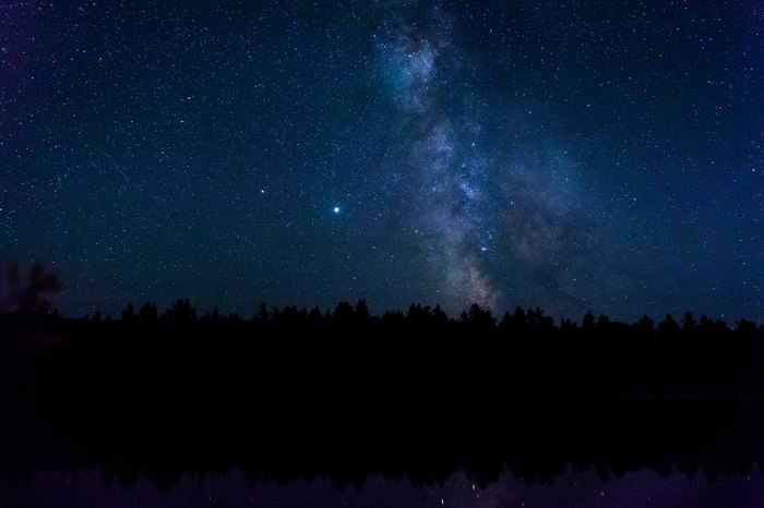 The Milky Way Galaxy reflected in a lake in the Minnesota Boundary Waters Canoe Area