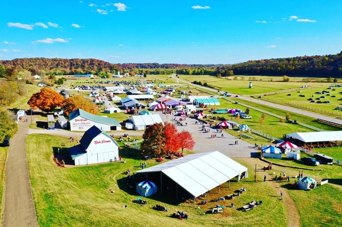 Aerial view of a large festival on a farm.