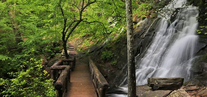 Hike To This Waterfall Fairy Tale Foot Bridge In North Carolina For A View You Can't Pass Up