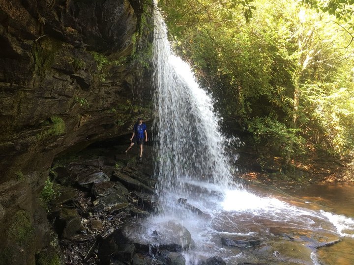 Hike Behind A Waterfall On The 5.6-Mile Schoolhouse Falls Trail In North Carolina