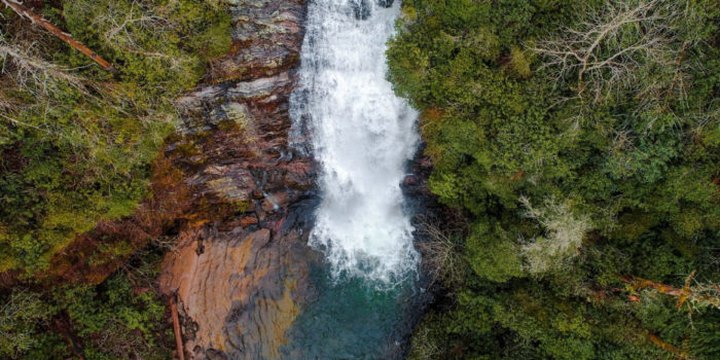 Plan A Visit To Secret Falls, North Carolina's Beautifully Blue Waterfall