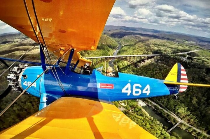 Soar Over The Nation's Newest National Park Aboard A WWII Biplane In West Virginia