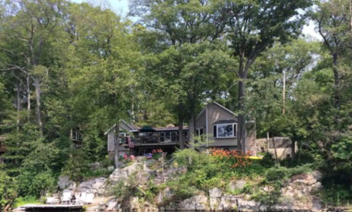Enjoy A Hot Tub, Water Views, And a Treehouse At This New Jersey Lake House