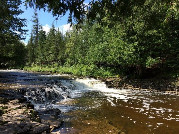 Michigan’s Most Easily Accessible Waterfall Is Hiding In Plain Sight At Ocqueoc Falls Scenic Site
