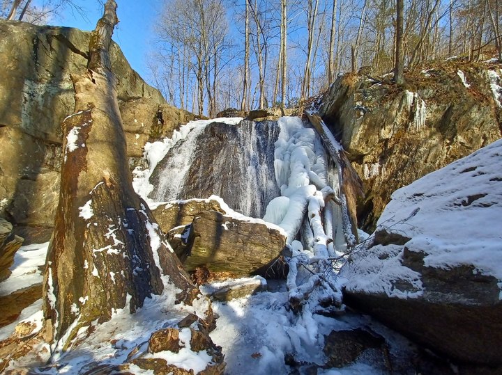 Marvel Over A Frozen Waterfall And Snow-Frosted Rock Formations On This Winter Hike In Maryland