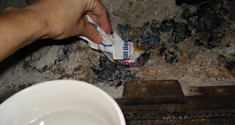 Moist newspaper dipped in ash