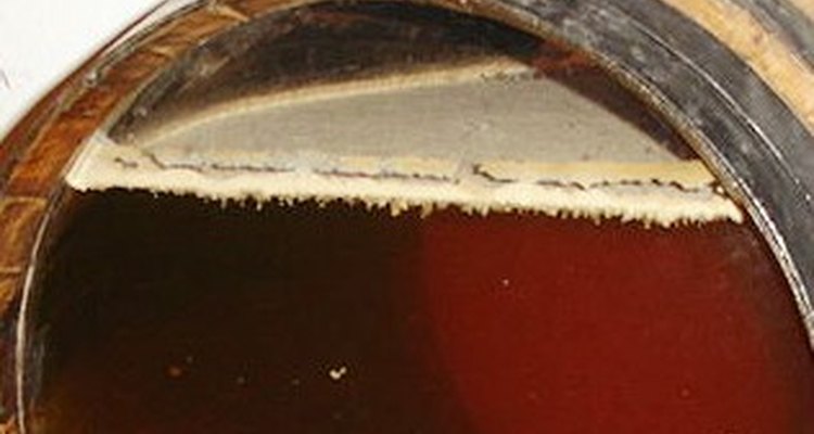 Flor tops sherry in a transparent-ended bota.