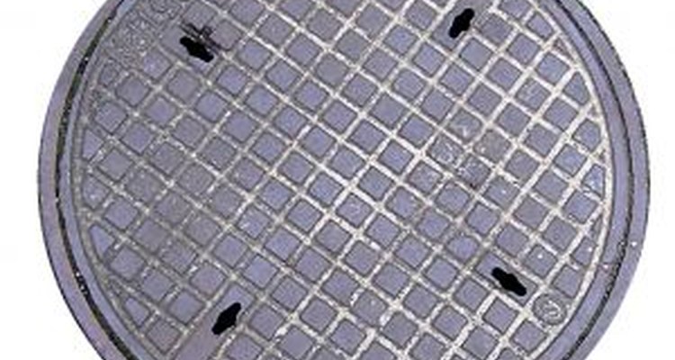 A manhole cover can easily be removed with the right tools.