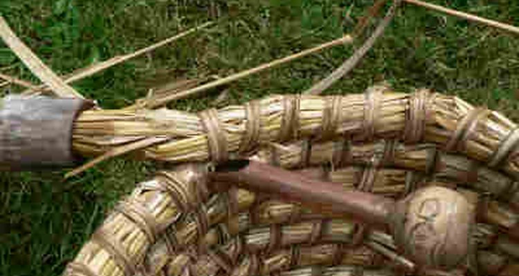 Binding going through the row previous the working row to lock the coils in place