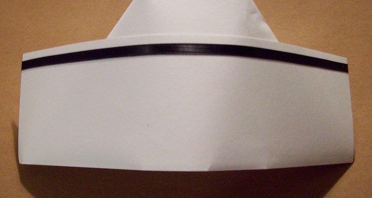 Make a nurse's cap from stiff, white paper