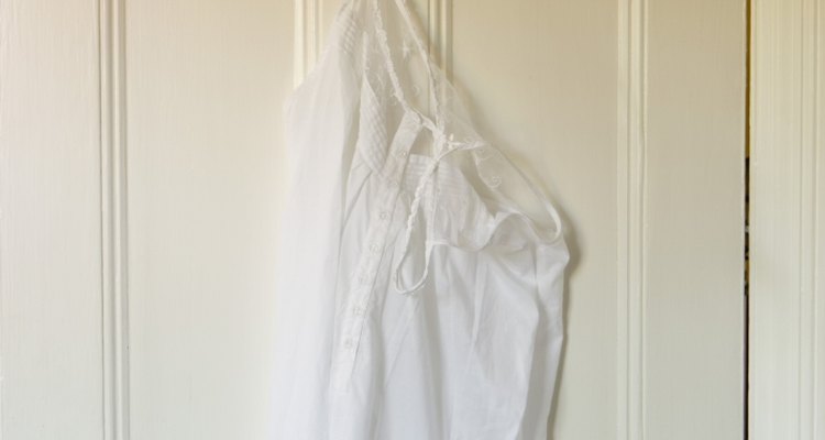 Find a place for your coats by fitting door hooks.