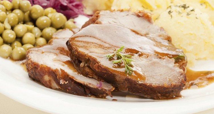 Defrost the pork joint thoroughly before roasting it in the oven.