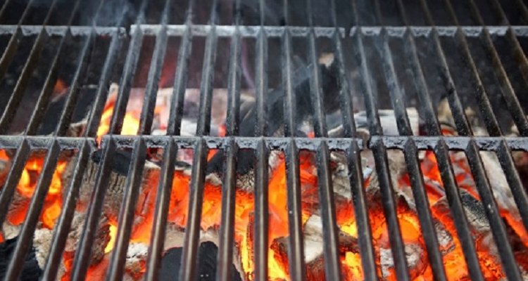 Charcoal grill construction can be simple as laying grates across breeze blocks.