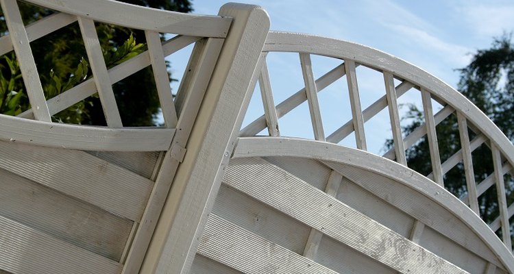 Prolong the life of wooden fence posts with creosote.
