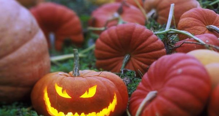 eHow Style editor Christa Fletcher models the jack-o'-lantern she made with eHow’s “Spooky Face” template.