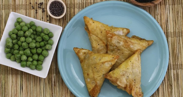 Fold a perfect samosa shape and then seal the edges.