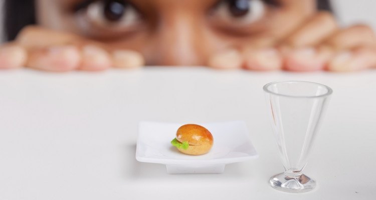 What causes cholesterol deposits around the eyes?