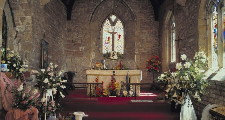 Altar flowers help draw the focus to the front of the church.
