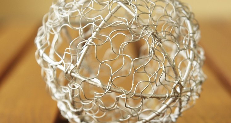 Use lights shaped into snowflakes to cover the ball for a frosty design.