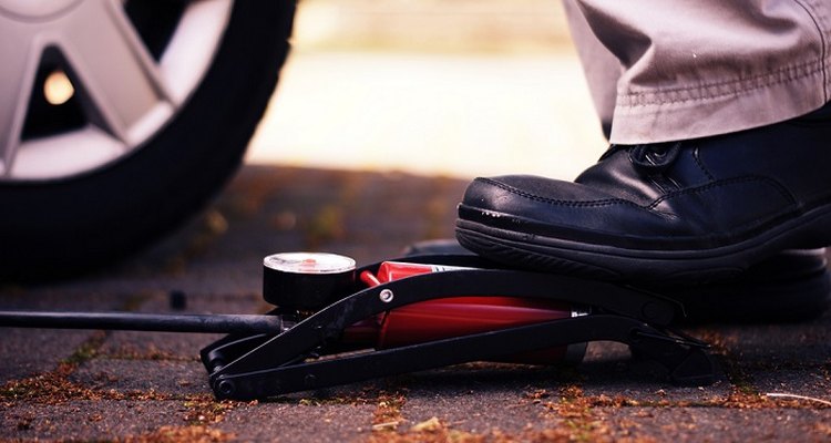 Fix a flat tyre with a foot pump.
