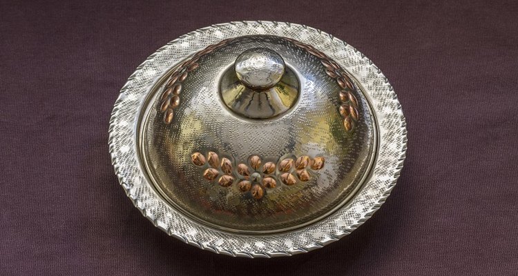 Remove tarnish from nickel-plated ornaments and tableware.