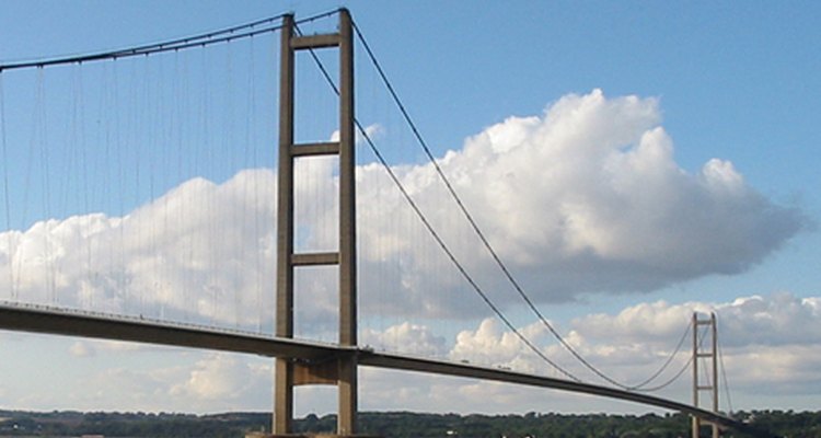 Create a cardboard bridge that mimics the beauty and grace of a suspension bridge.