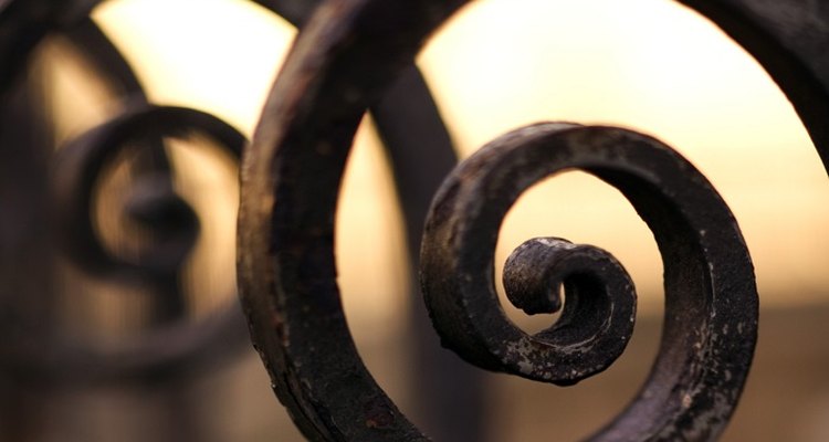 Coat the wrought iron gate with an etching primer.