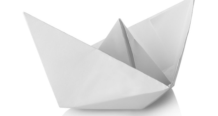 Fold paper into a hat shape.