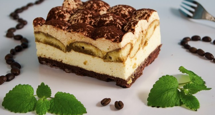 Top tiramisu with cocoa powder just before serving.