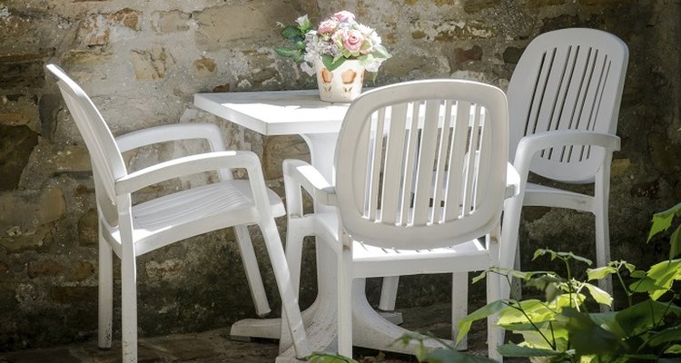 Clean white plastic outdoor furniture to keep it attractive.