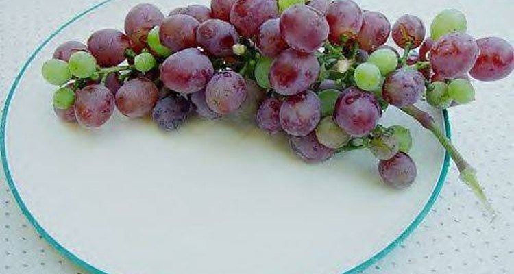 Bunch of grapes on a plate.