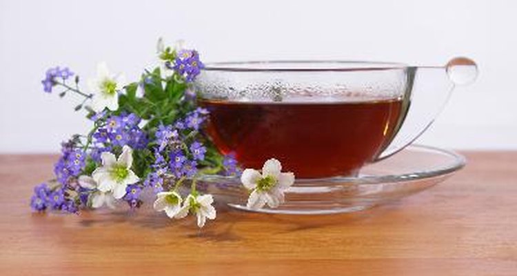 Black tea in a cup and flowers