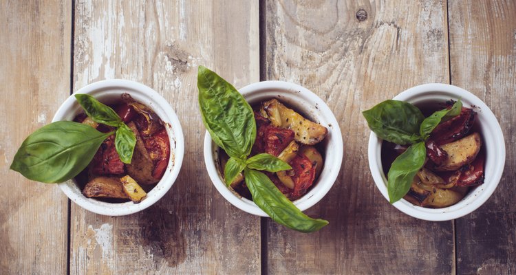 Vegan food: three plates of grilled vegetables