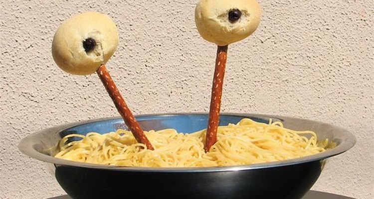 Puffy eyes poking out of a bowl of noodles
