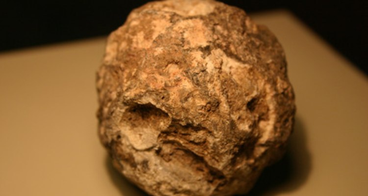 An unopened geode looks like a spherical rock, but inside the rock is lined with crystal.