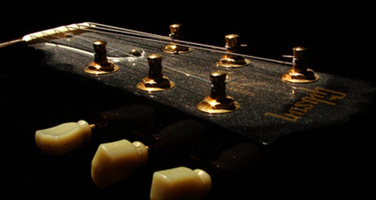 The truss rod cover on a ES-335 Dot guitar is the bell-shaped plate on the head stock.