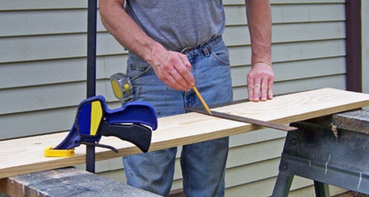 Drawing your desired curve on plywood, and cutting out the curve, helps you to bend the aluminium tubing as desired.