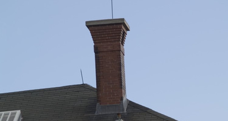 The chimney flashing blocks water from entering through the seam where the chimney meets the roof